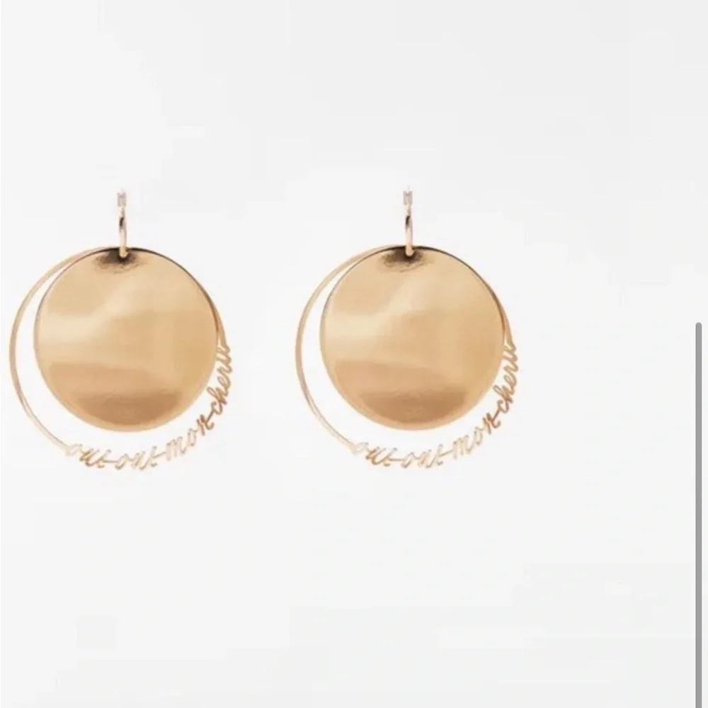 - NWT. Zara Golden Round Flat Metal Earrings with Text Detail.